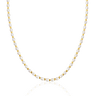 Pearl necklace with gold beads on a white background dorsya