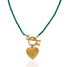 A necklace with green malachite beads and a gold heart-shaped pendant, with a gold toggle clasp.