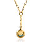 A gold-colored Iconic December Birthstone Necklace with a locket pendant containing blue topaz gemstones, attached to a chain.