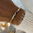 Gold Bangle with Sparkling Cubic Zirconia Stones | Elegant Jewellery Accessory for Glamorous Looks | Dorsya