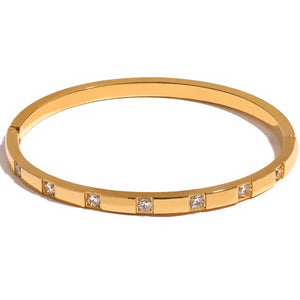 Gold Bangle with Sparkling Cubic Zirconia Stones | Elegant Jewellery Accessory for Glamorous Looks | Dorsya