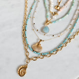 Multiple Gold Necklaces Ammonite Pendant