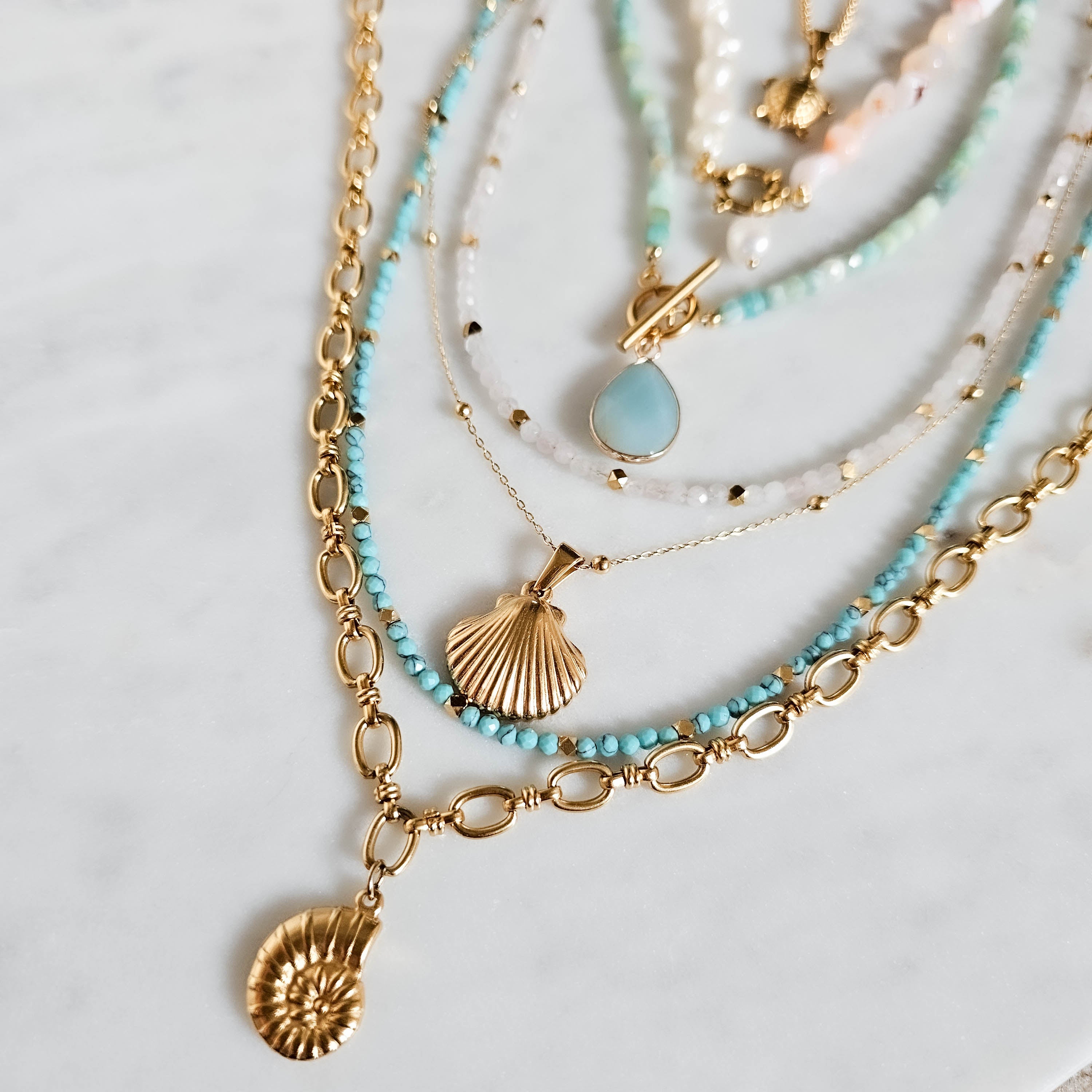Multiple Gold Necklaces Ammonite Pendant