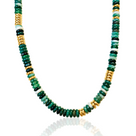 Necklace with green gemstones  and gold beads on a white background dorsya gifting season